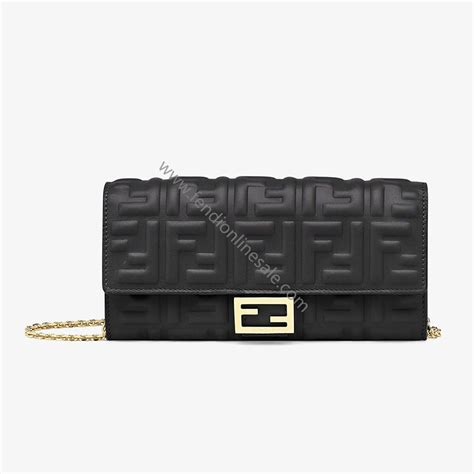 Baguette leather wallet on chain in black .